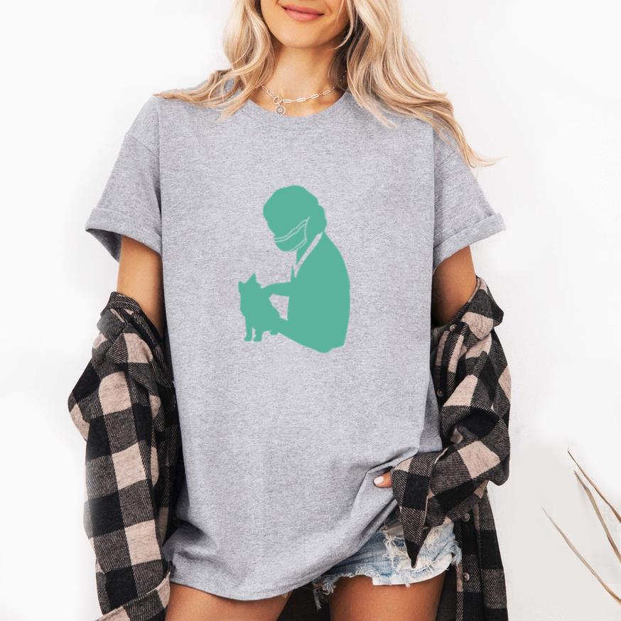 Silhouette Of A Veterinarian Holding A Cat In Green T-Shirt